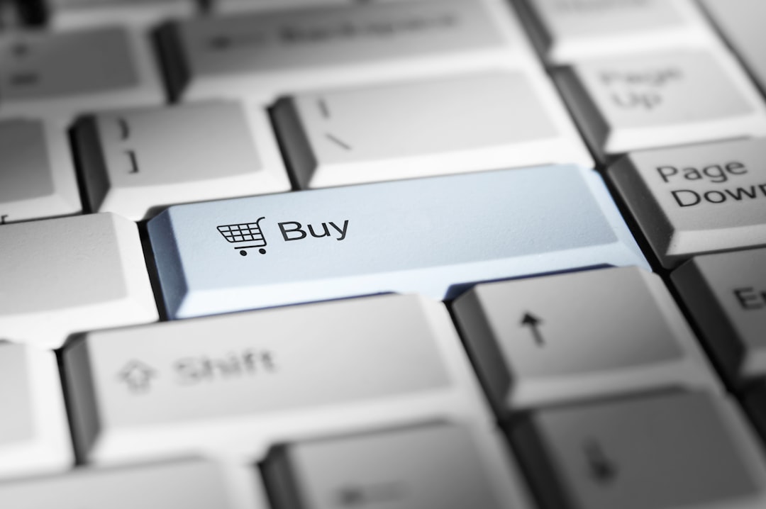 Shopping cart icon and the word Buy on a computer keyboard.